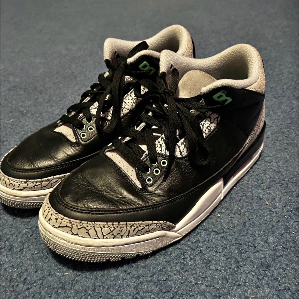 Black and Gray Sneakers with Green Accents